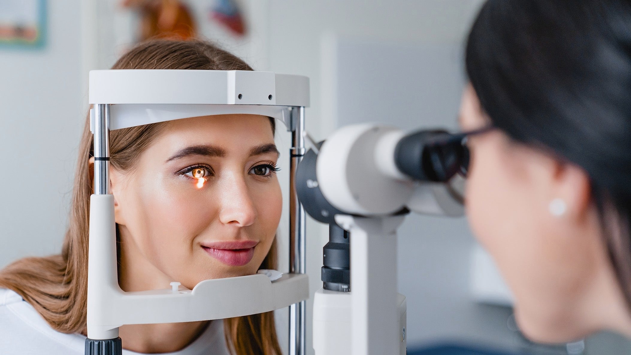 eye doctor examining woman